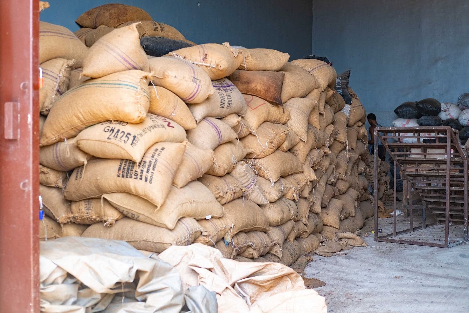 A warehouse in Nigeria stacked to the ceiling with jute sacks of cocoa.